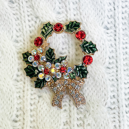 キラキラストーンの メタルリースブローチ