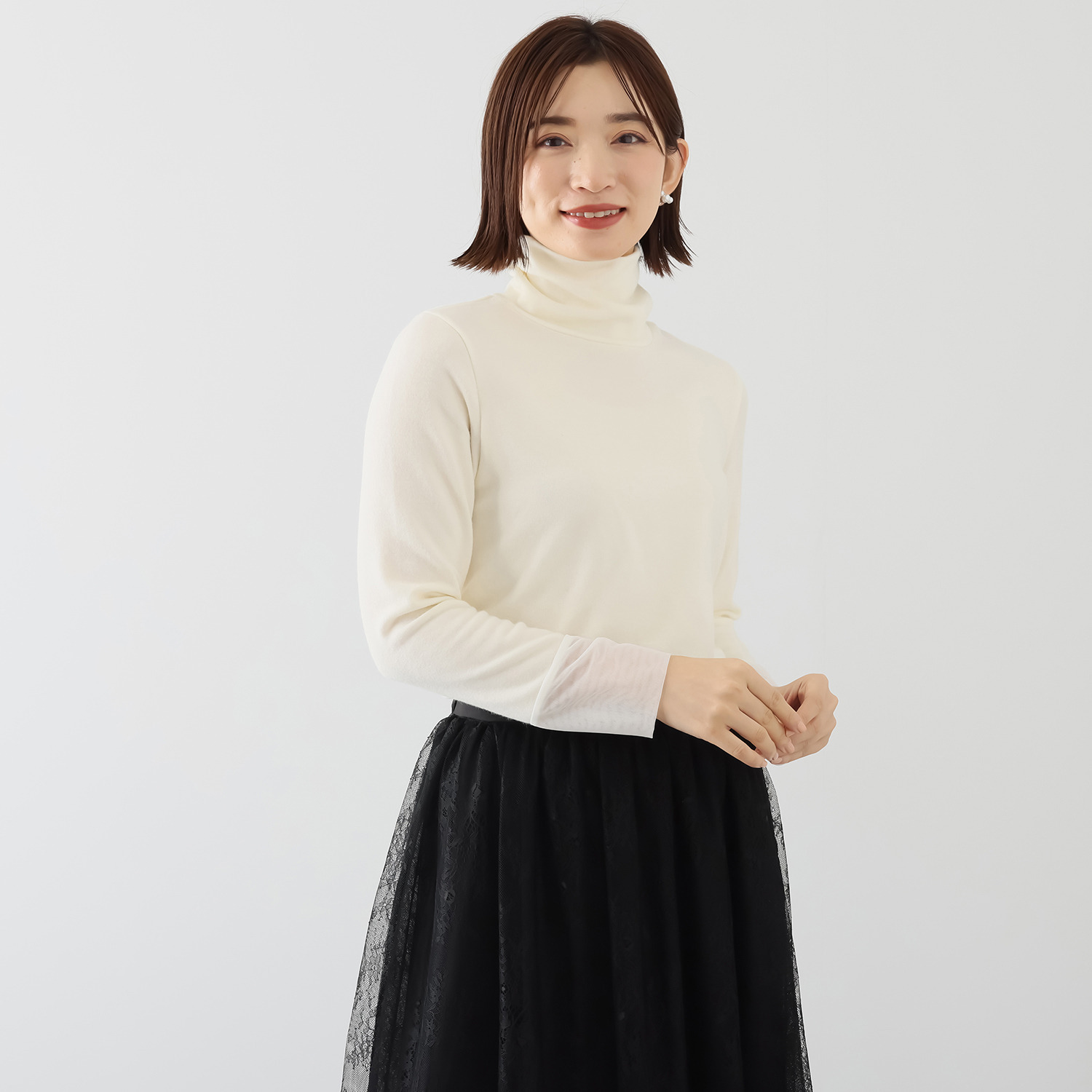 ボンボン・エ・ショコラ タートルネック カフスチュールトップス