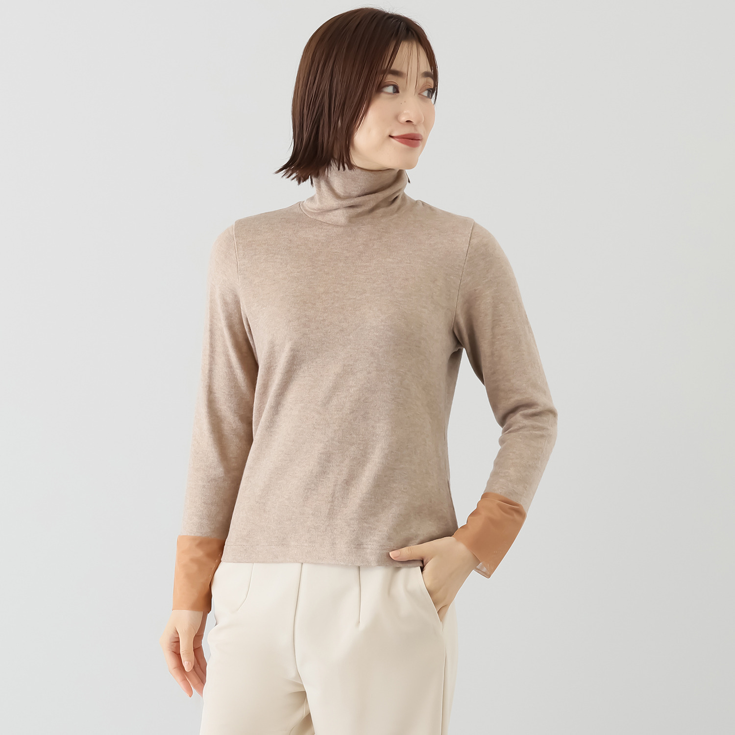 ボンボン・エ・ショコラ タートルネック カフスチュールトップス