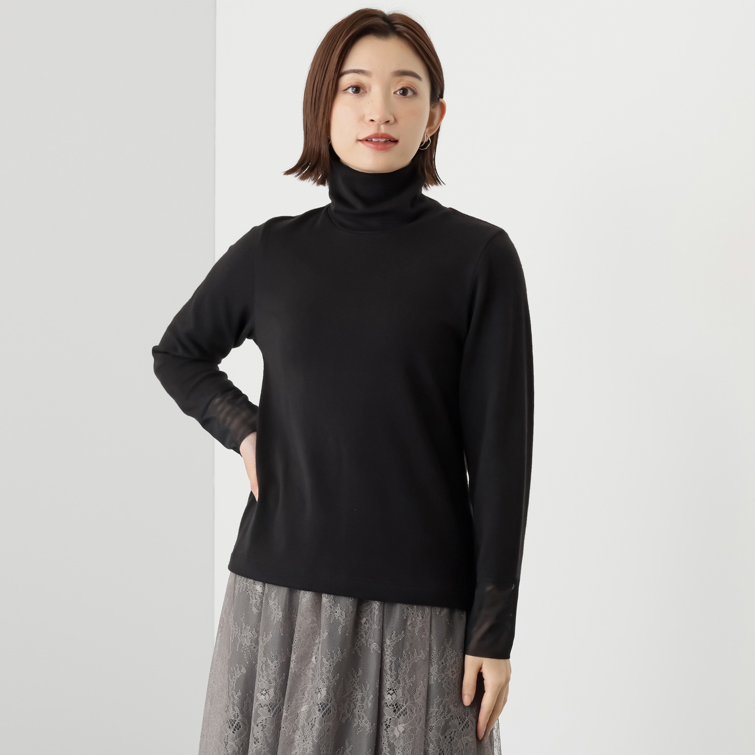 ボンボン・エ・ショコラ タートルネック カフスチュールトップス