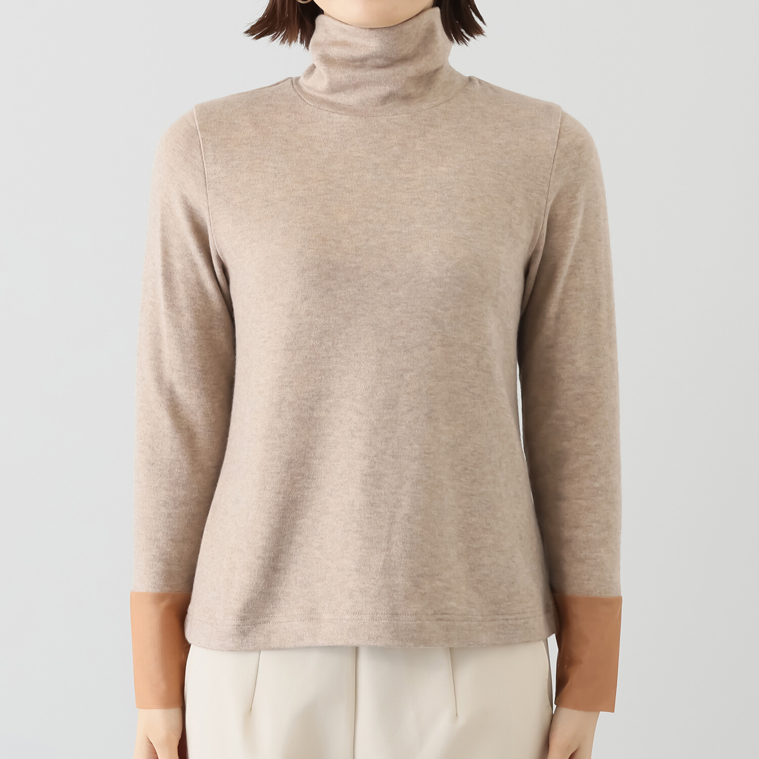 ボンボン・エ・ショコラ タートルネック カフスチュールトップス