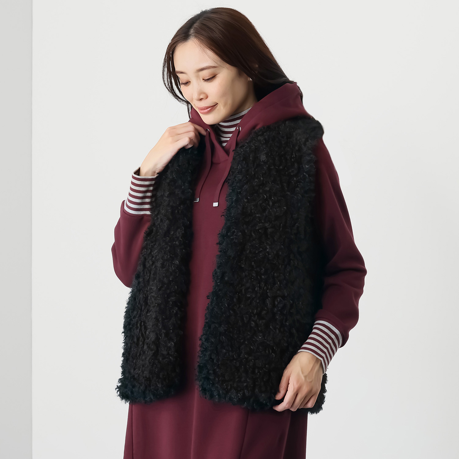 ゼラールスポーツ きれいめ艶やか カーリーフェイクファー ミディ丈ベスト