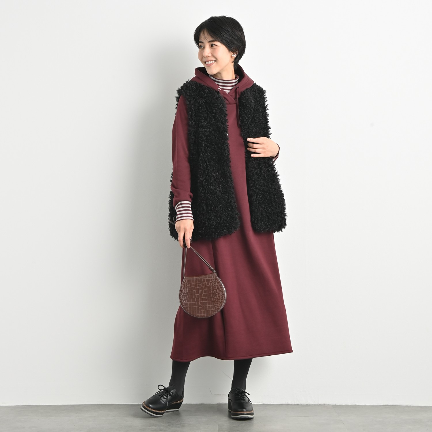 ゼラールスポーツ きれいめ艶やか カーリーフェイクファー ミディ丈ベスト